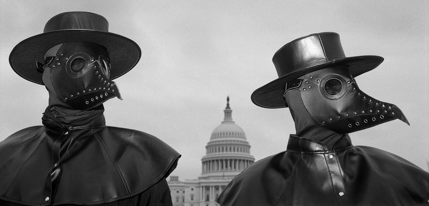 060_North-and-Central-America_Long-Term-Projects_Louie-Palu-WPP2022-850 (3) - Two activists wear beaked masks like doctors wore in the 17th century during times of plague, seeking to draw the attention of spectators around Capitol Hill. Their message: Refusing to be vaccinated will prolong the COVID-19 pandemic. On the same day, two House subcommittees held a joint hearing titled “Disinformation Nation: Social Media’s Role in Promoting Extremism and Misinformation.”


